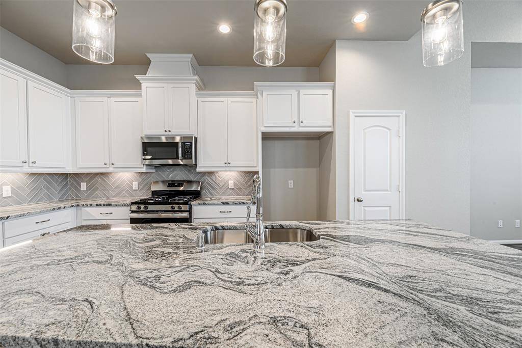 Stainless Steel Refrigerator Included.