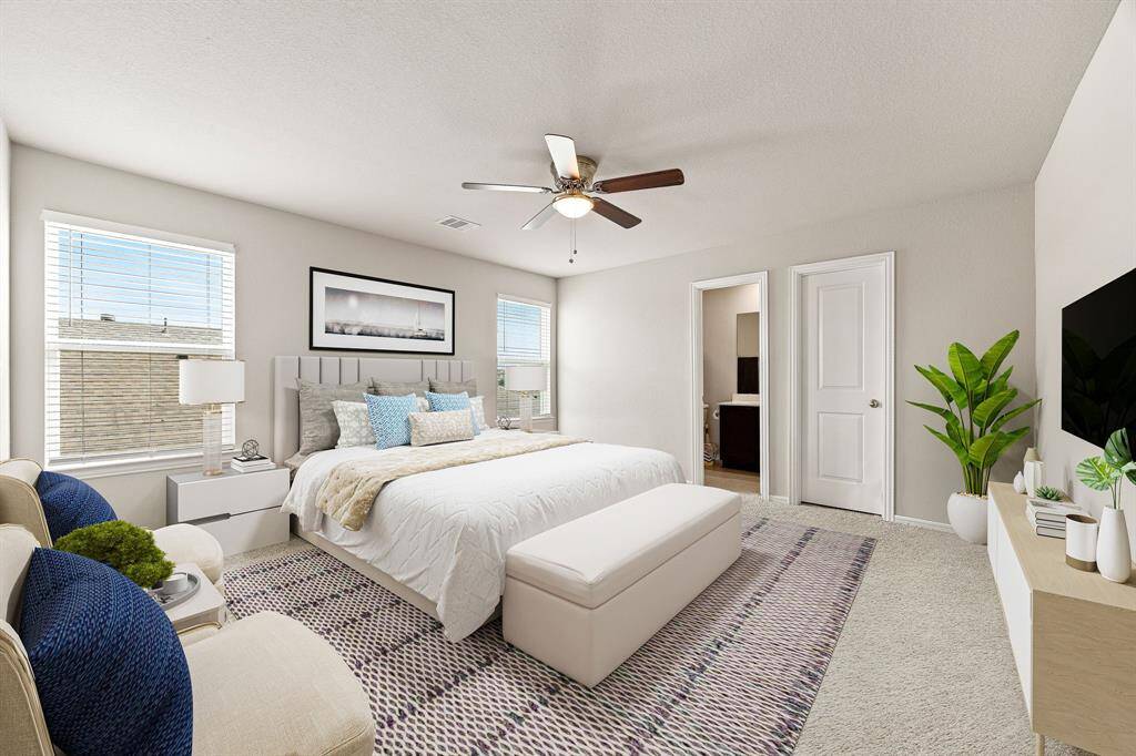 Secondary bedroom great for use as an in-law suite or guest suite features high ceilings, lovely modern ceiling fan, custom paint, plush carpet, space for seating area, direct access to the secondary bathroom and large window with privacy blinds. *Virtully Staged
