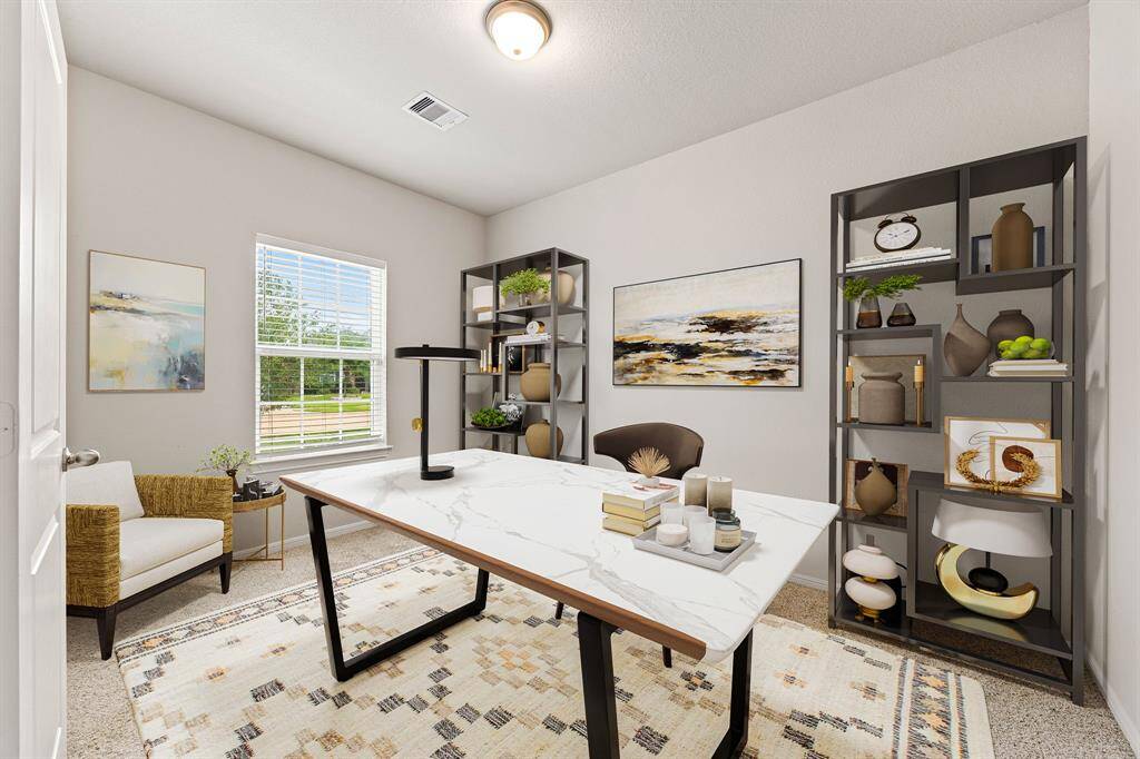 Nestled away quietly in the front of the home is the handsome and grand home office. Featuring high ceilings,  custom paint, plush carpet, and large windows with privacy blinds. *Virtually Staged