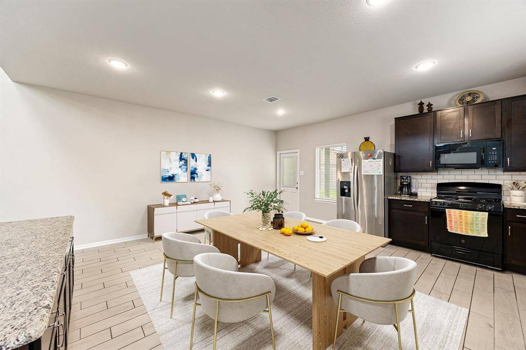 Start your day off right with a cup of coffee sitting with your family in the lovely breakfast area! Featuring large windows with blinds, custom neutral paint, wood stlye flooring, recessed lighting and high ceilings. *Virtually Staged