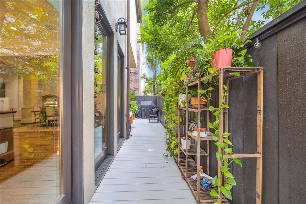 Private side patio with room for grilling, dining, or container gardening.