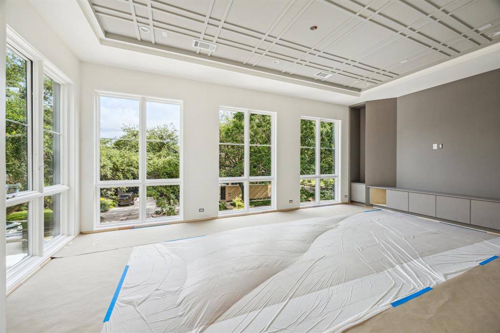 Second Floor Median Room.  Incredible ceiling detail, built-in storage cabinets.
