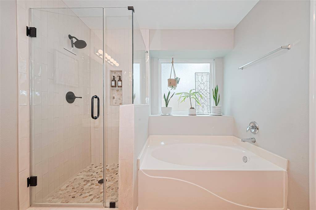 Brand new shower and tub with a tinted window that adds natural light while maintaining privacy.