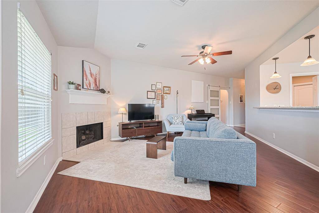Another view of the living room and breakfast bar, with plenty of space for barstools!
