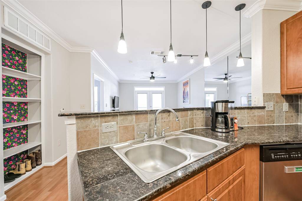 You'll like the kitchen layout that allows for clean up and food prep while still being able to talk to family and friends in the living area.