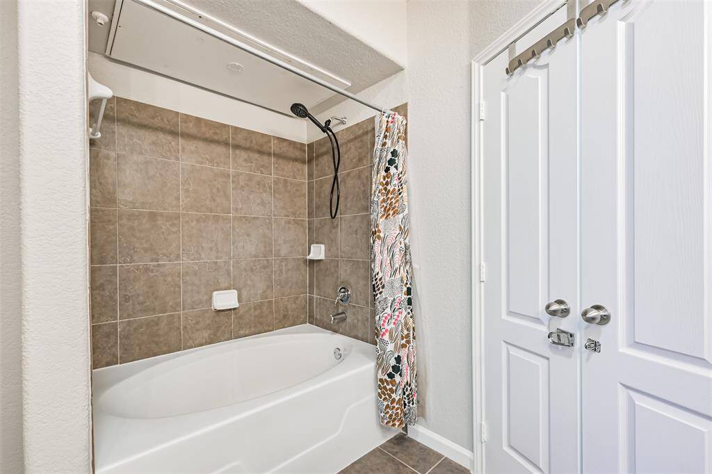 Oversized soaking tub and shower.