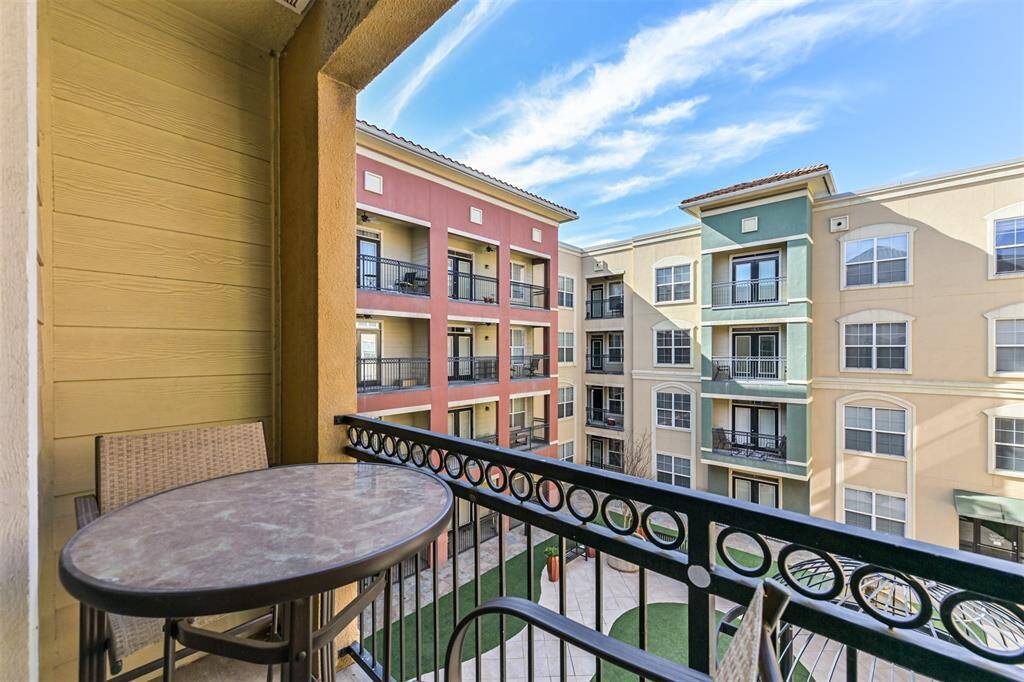 Small private balcony overlooks a peaceful courtyard.