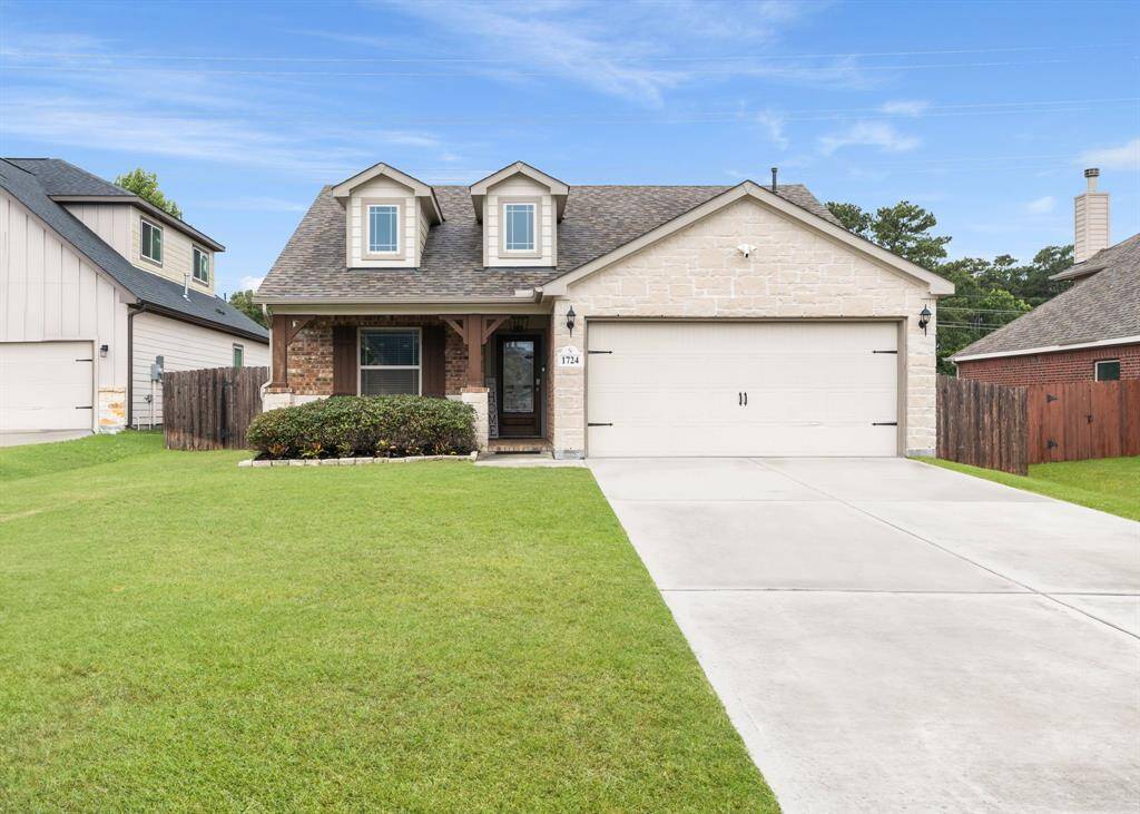 large, deep-set front yard and double wide driveway