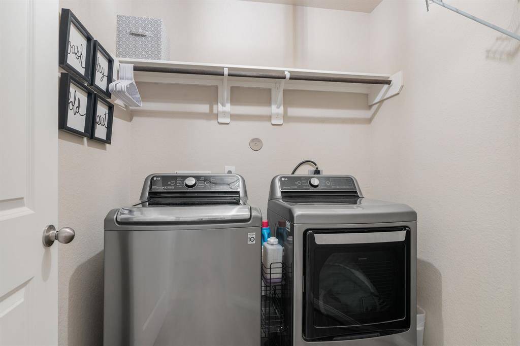 Laundry room with bar and shelving