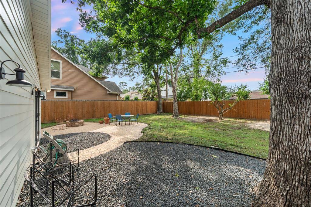 View of the backyard hardscape off of the primary bedroom.