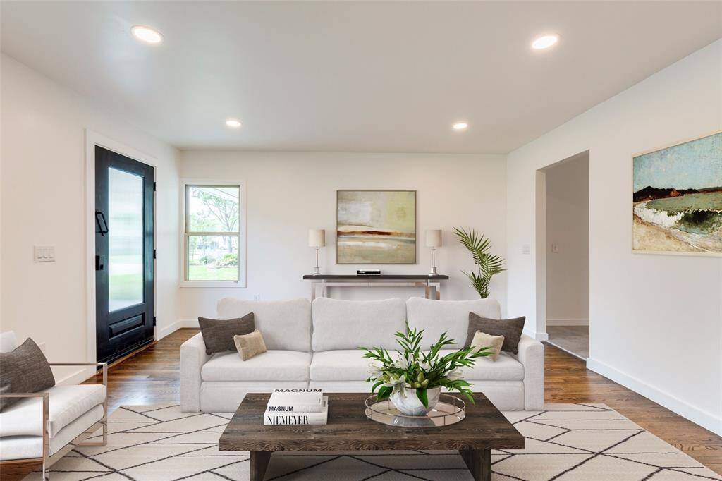 This virtually staged living room features a modern and inviting virtually staged design with a neutral color palette.