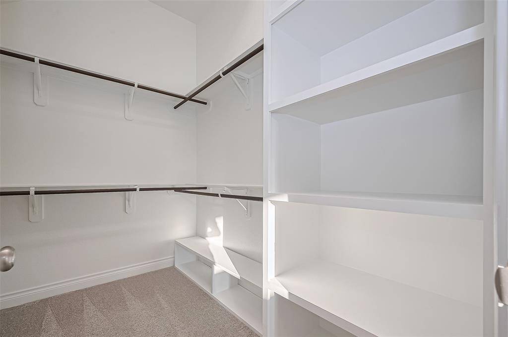 Both Primary closets have additional shelving added