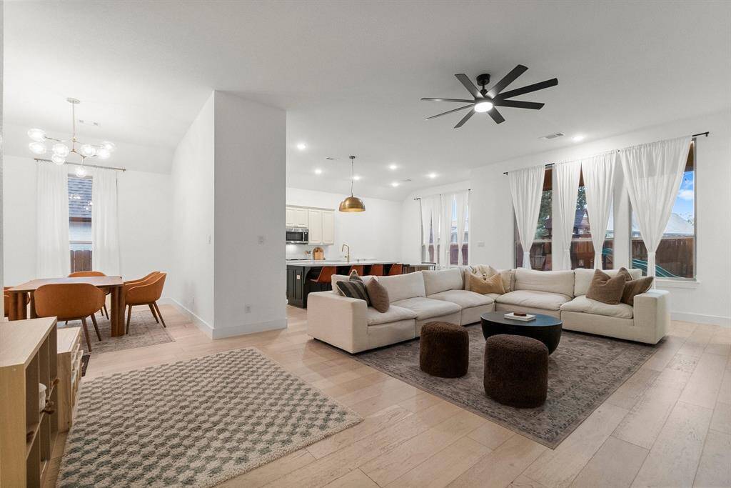This home lives large with its open floor plan and a wall of windows showcasing the backyard beyond. It’s the perfect place to gather and entertain! There is also a nearby bonus room which can be used as a game or media room to extend the entertaining options!