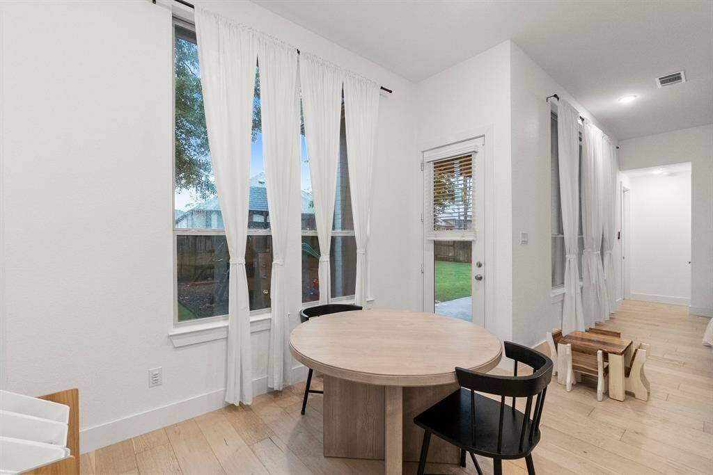 Additional Breakfast area is great for family dinners or a morning cup of coffee!  Features include wood plank  flooring, 6-inch baseboards, recessed lighting, and double windows for abundant natural light. You can also sit additional people at the Kitchen Breakfast bar.