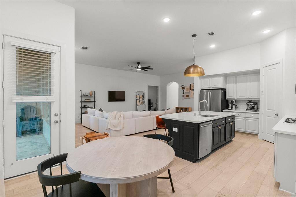 Another view of the Breakfast area looking toward the Kitchen and Family room.  The backyard and covered patio are easily accessed from this area to make outdoor entertaining a breeze!