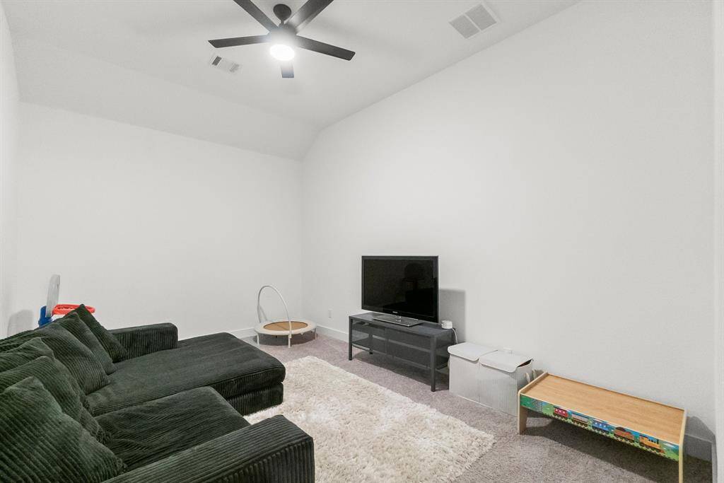 This expansive bonus room offers exceptional flexibility to suit your lifestyle—whether as a media room, a second home office, fitness space, game room, or creative studio. It boasts a large walk-in closet for games, media electronics, or home office file cabinets. This space has endless possibilities and is centrally located in the home. Click on the movie reel icon to view our walk-through video of this versatile space.