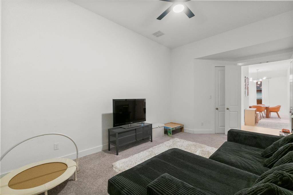 Awesome media or game room has everything you need to sit back and enjoy a movie night with the family or watch a sporting event with friends! Designed with sound control in mind, it features double doors, no windows for optimal screen visibility, plush carpeting, sloped ceiling, and a lighted ceiling fan. Why deal with the lines and crowds when you can enjoy a theater experience in your own home?