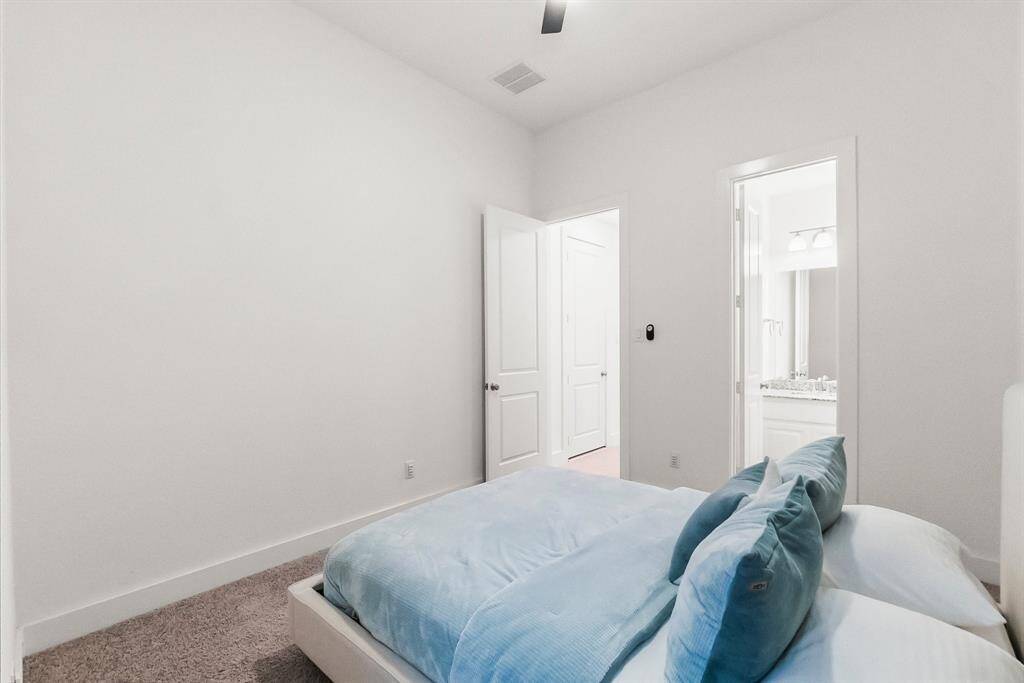 Another view of this secondary bedroom with a glimpse of the en-suite bath.
