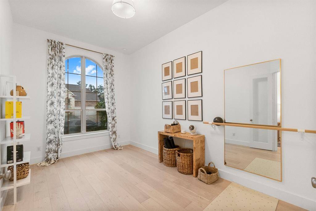 Working here will be easy in this spacious office with a sunny arched window. Features include engineered wood flooring, 6-inch baseboards, French doors, and a decorative ceiling light. Click on the movie reel icon to view our walk-through video.