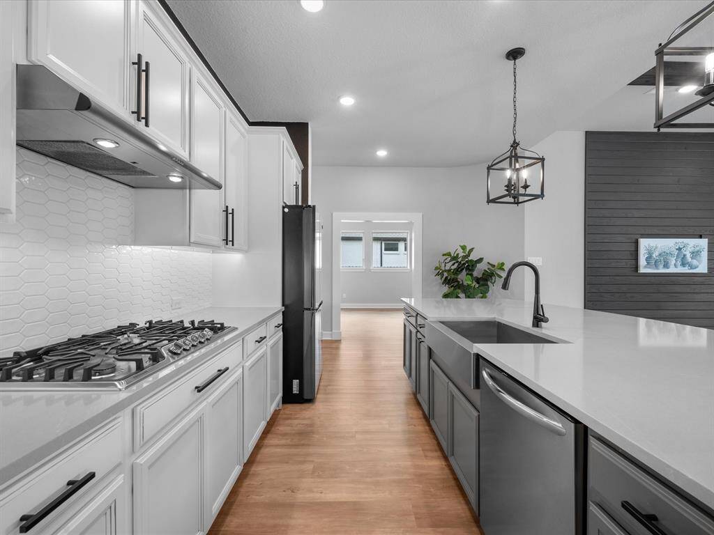 Kitchen had been beautifully crafted with designer MZ artezen elegant white picket porcelain tile backsplash & Under Cabinet Lighting built-in.