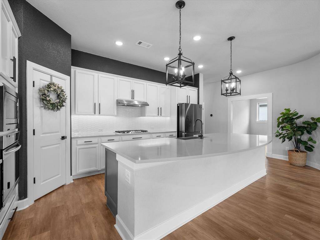 Pantry is a Walk-In with tons of shelving and storage is ample in this kitchen!