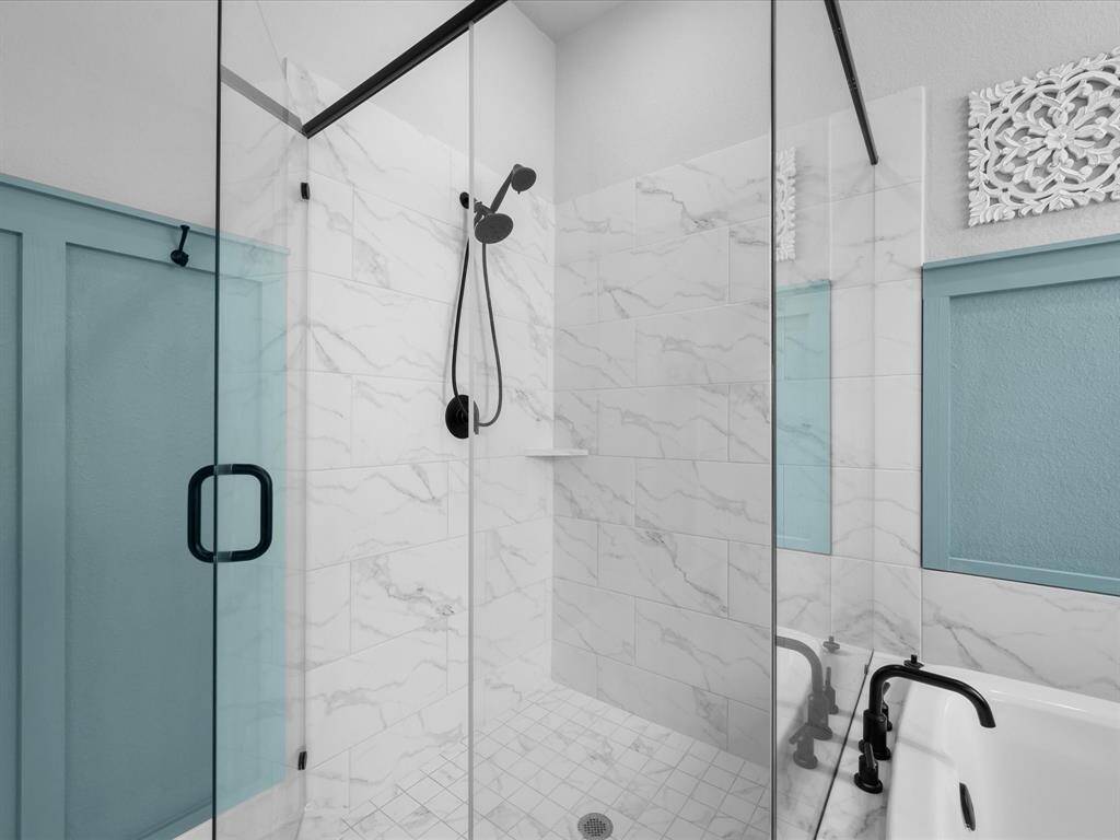 Frameless Walk-In Shower wrapped in porcelain tile & tile flooring