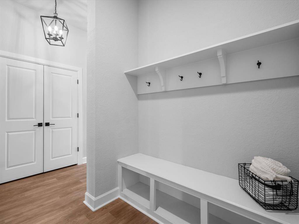 Convenient Drop-Zone with hooks as you enter the home from the garage.