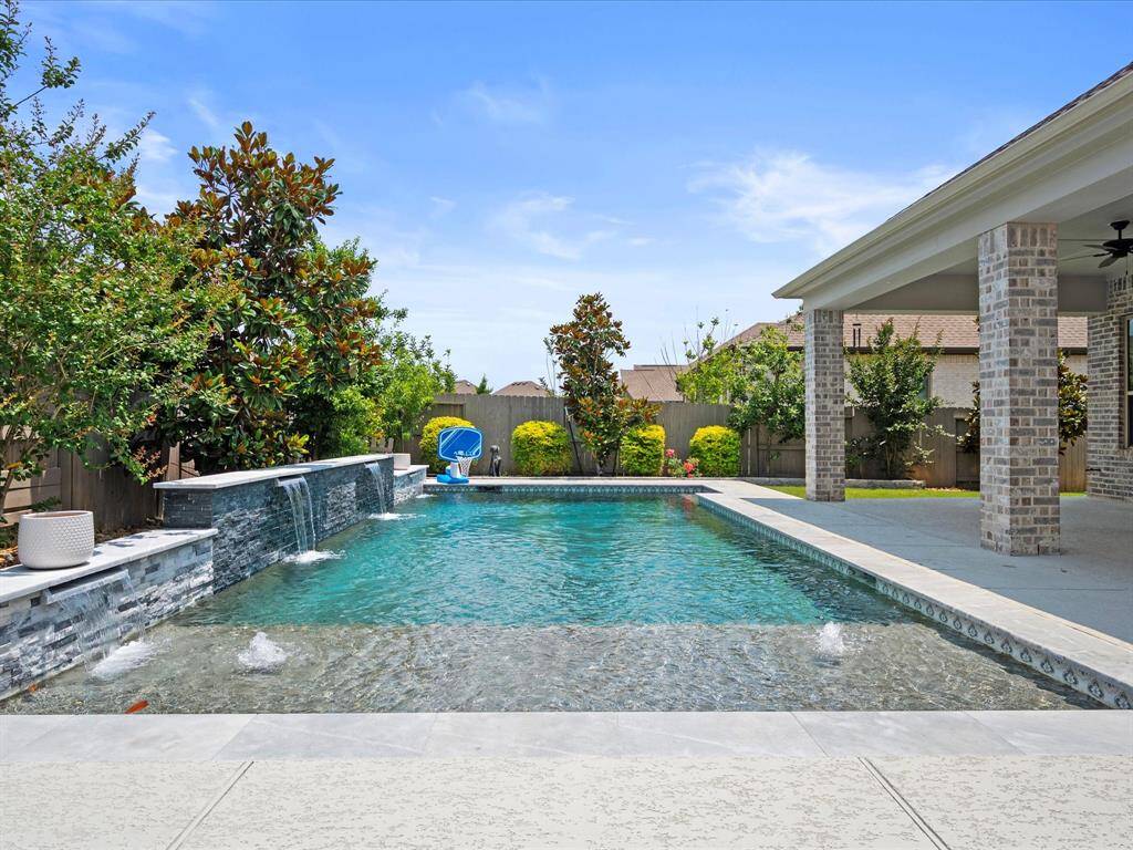 Custom Built HEATED Pool featuring upgraded dark gunite, water features AND Baja Shelf.  Pool mechanics are PENTAIR PRODUCTS!