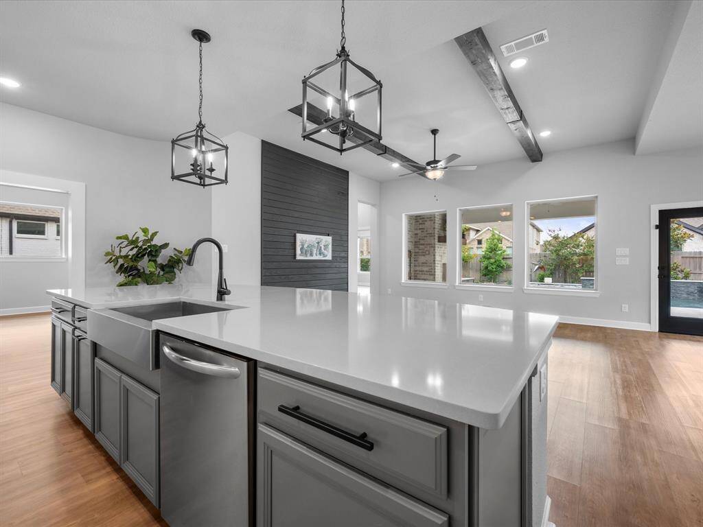 Quartz Countertops on this massive island with beautiful pendant lighting