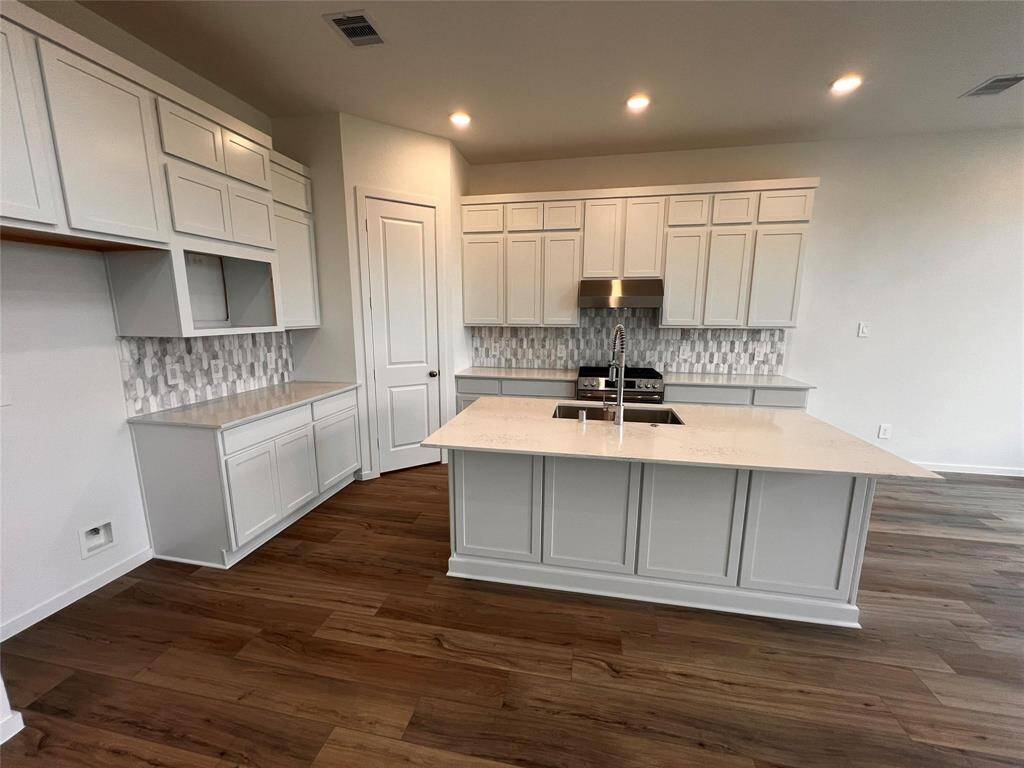 Experience modern living with a sleek kitchen featuring stainless steel appliances in this beautifully updated home, perfect for your next chapter.