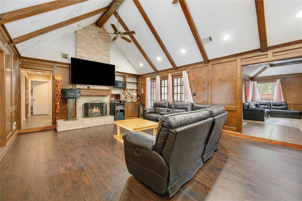 Enjoy a spacious living room with lots of natural light and cozy fireplace
