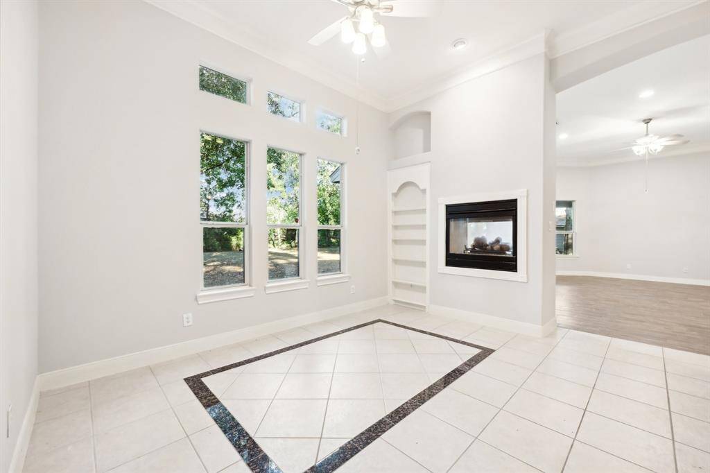 Breakfast Room with double fireplace and custom built-ins