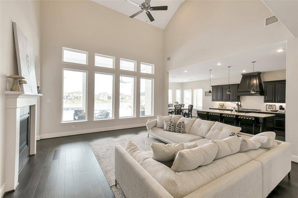 View of the open floor plan with Living Room, Kitchen and Dining Area all having views to the lake.