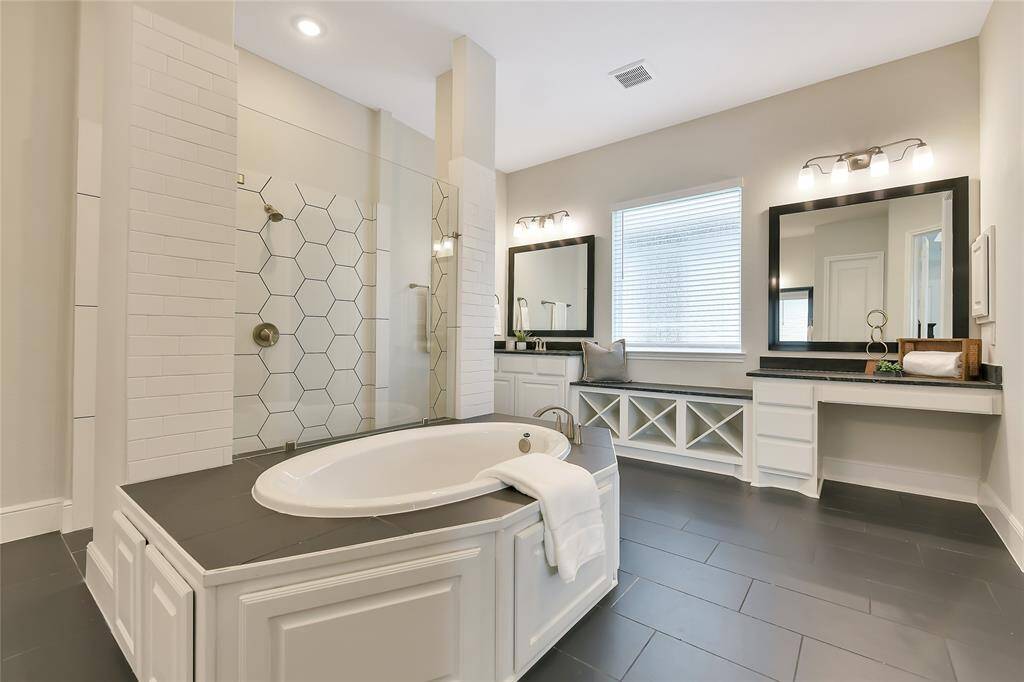 Magnificent Primary bath with tub, double vanities and "carwash" shower.
