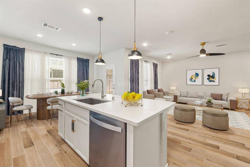 This kitchen is by far any chef’s dream! This spacious kitchen features large windows, high ceilings, white cabinets, cultured marble countertops, SS appliances, modern tile backsplash, recessed lighting with additional custom pendant lighting, extended counter space, granite kitchen island with double sink and space for breakfast bar and a walk-in pantry all overlooking your huge family room. *Virtually Staged