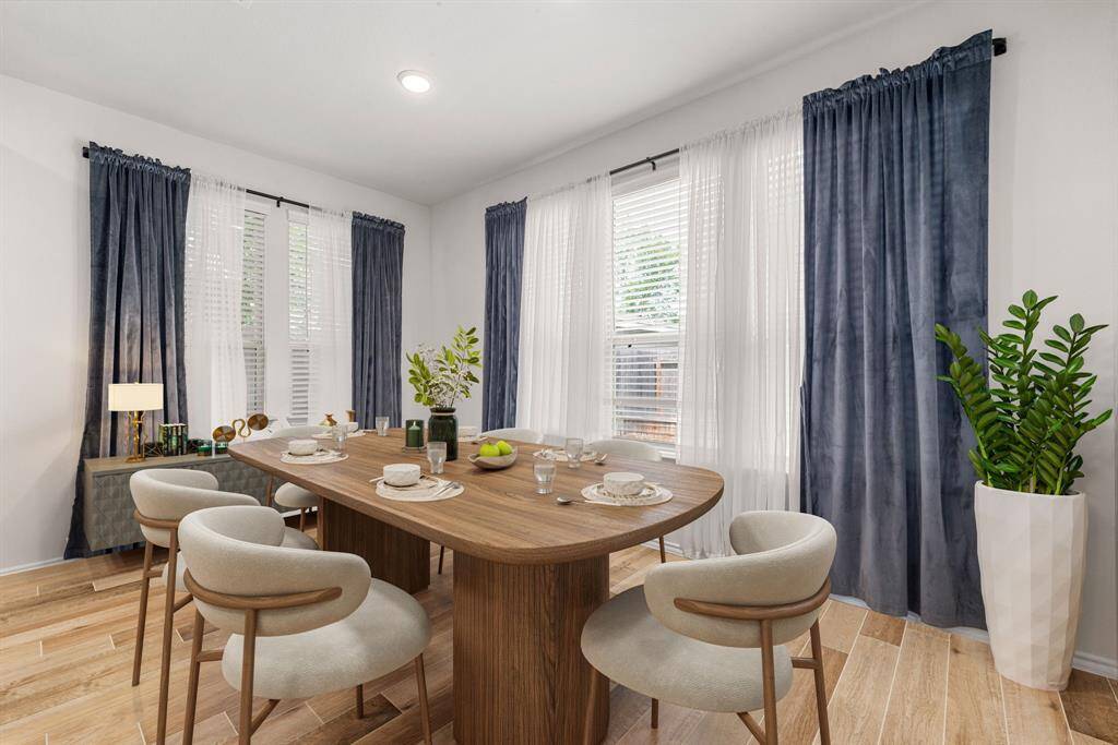 Elevate every meal in this sun-drenched dining room, where elegant lighting, generous space, and seamless flow to the kitchen set the scene for memorable gatherings. *Virtually Staged