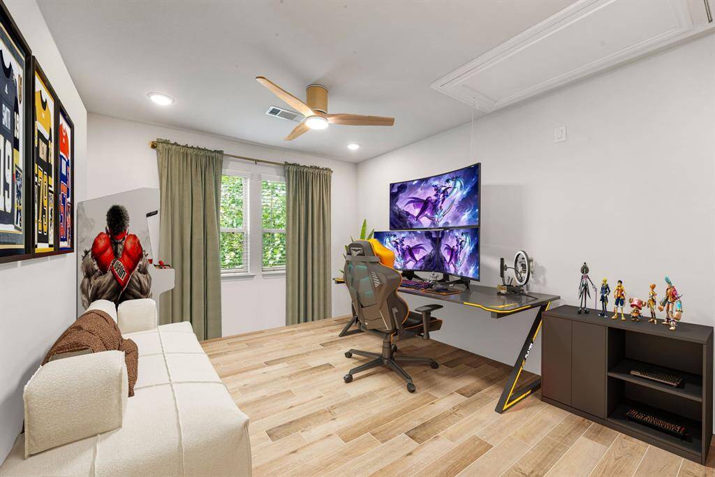 Perfect for entertaining is this amazing game room!  Right upstairs this space would be a fabulous teen hangout, media room, or adult game room complete with pool table and big screen TVs. Featuring wood style floors, high ceilings, a ceiling fan, custom paint and large windows. *Virtually Staged