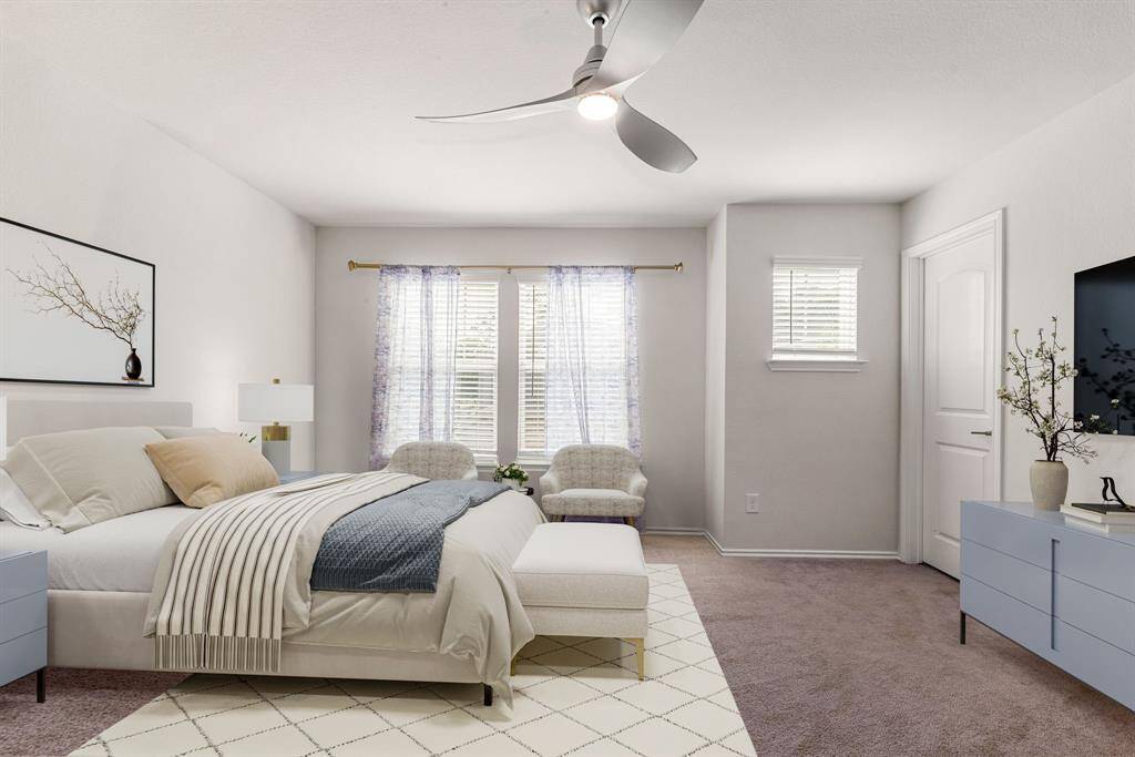 Secondary bathroom features light countertops and cabinets, custom paint, shower/tub combo with tile surround, large mirror, tile floors, sleek fixtures and modern finishes, plenty of space to accommodate any visiting family or guests.
