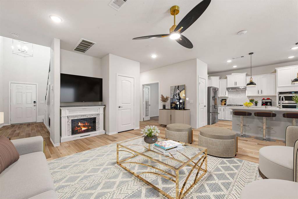 Gather, relax, and make memories in this inviting living room, bathed in natural light, anchored by rich wood-look floors, and perfectly laid out for effortless conversation and cozy movie nights. *Virtually Staged