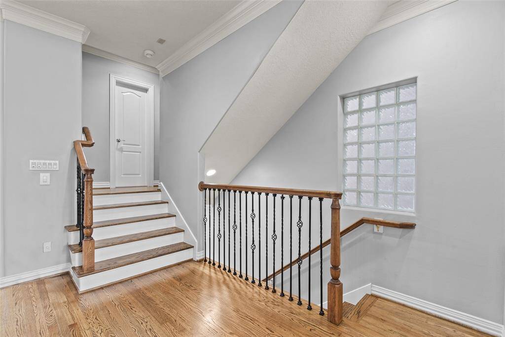 Short staircase off living room leads to guest powder room.