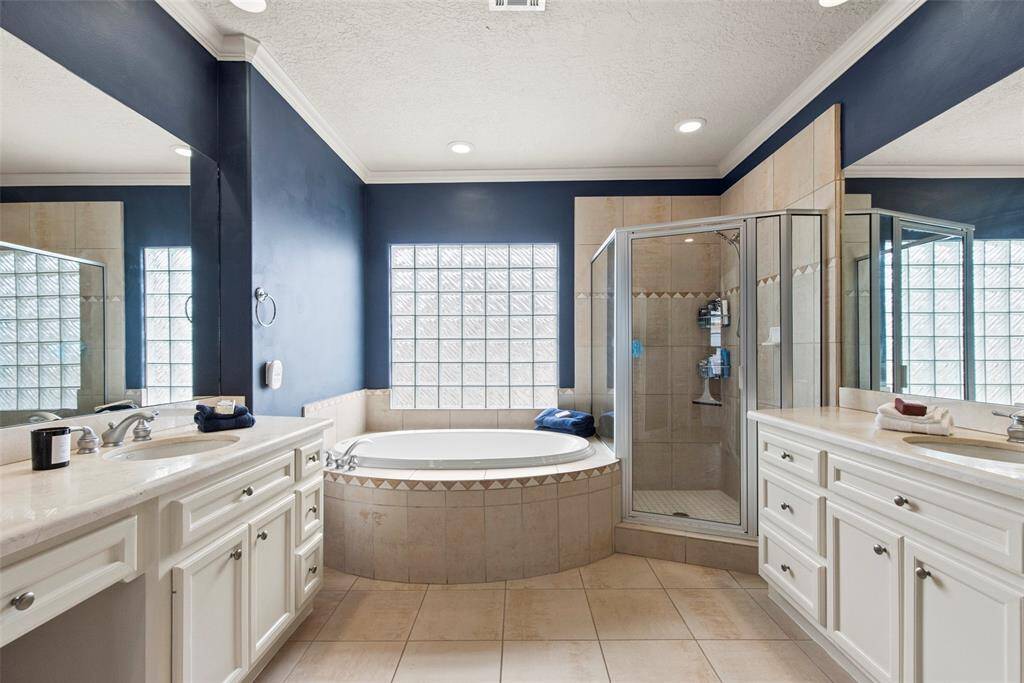 En suite Prinmary bath with walk in shower and jetted tub. Separate vanities as well as two walk in closets complete this luxurious spa like retreat