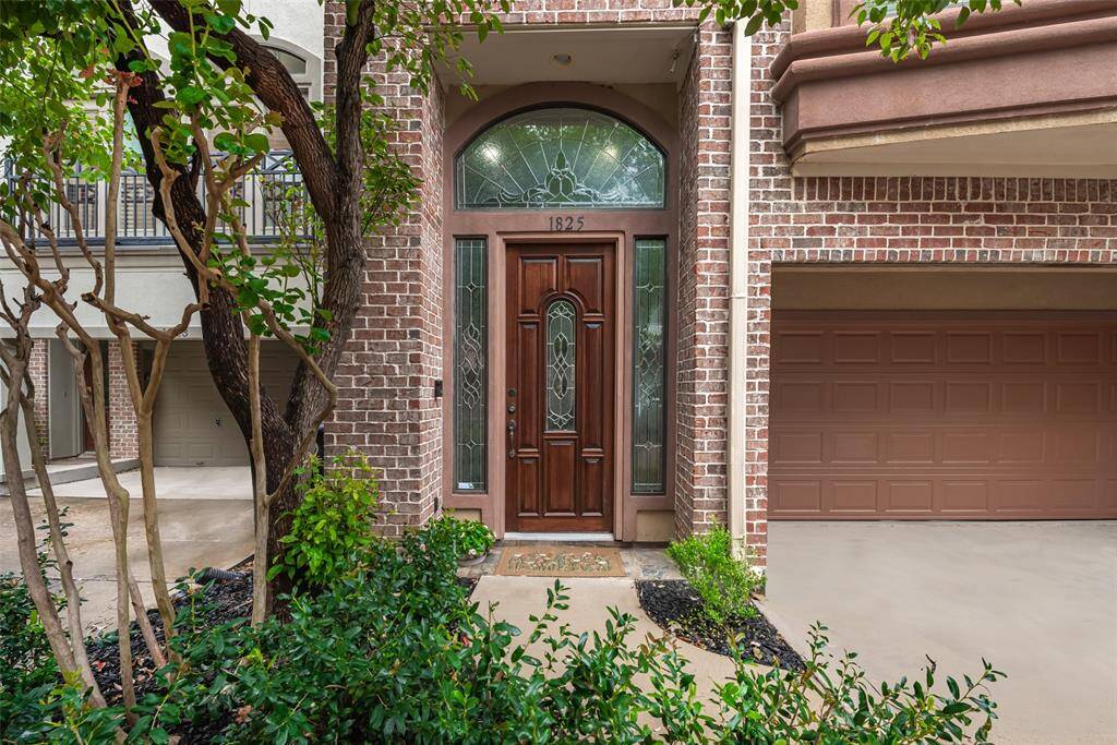 Lovely front entry with decorative glass front door.