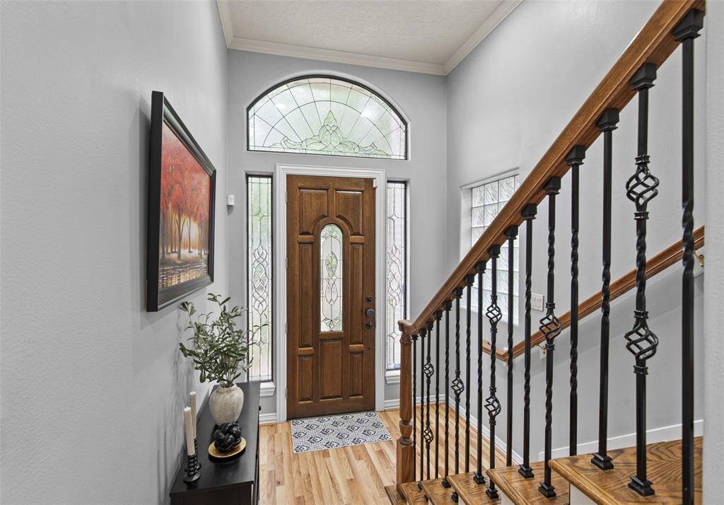 Spacious, light filled foyer with newly laid hardwood floors.