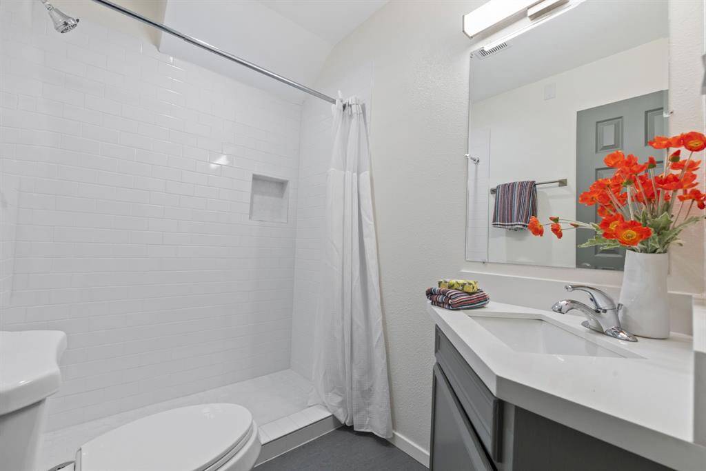 First floor bathroom with newly remodeled walk in shower