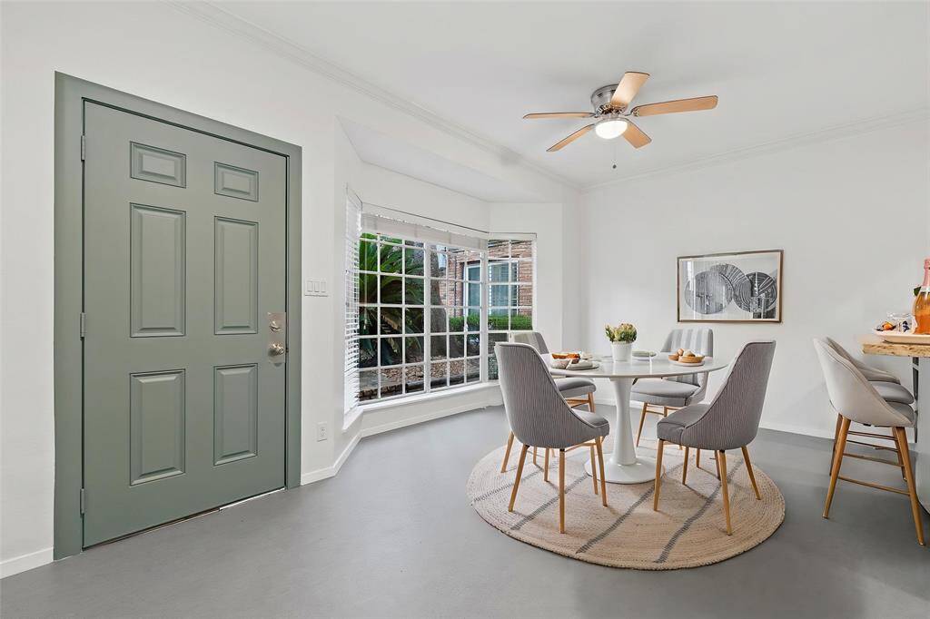 Dining area tucked next to Bay Windows overlooking courtyard