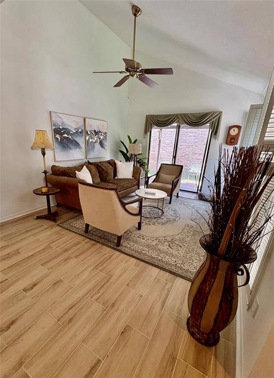 Welcome in to this beautiful living room with a vaulted ceiling and sliding patio door great for entertaining or just relaxing.