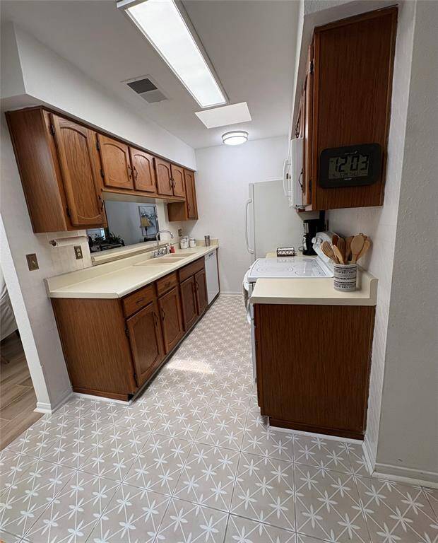 Kitchen has a brand new dishwasher and double oven for the cook in the house.