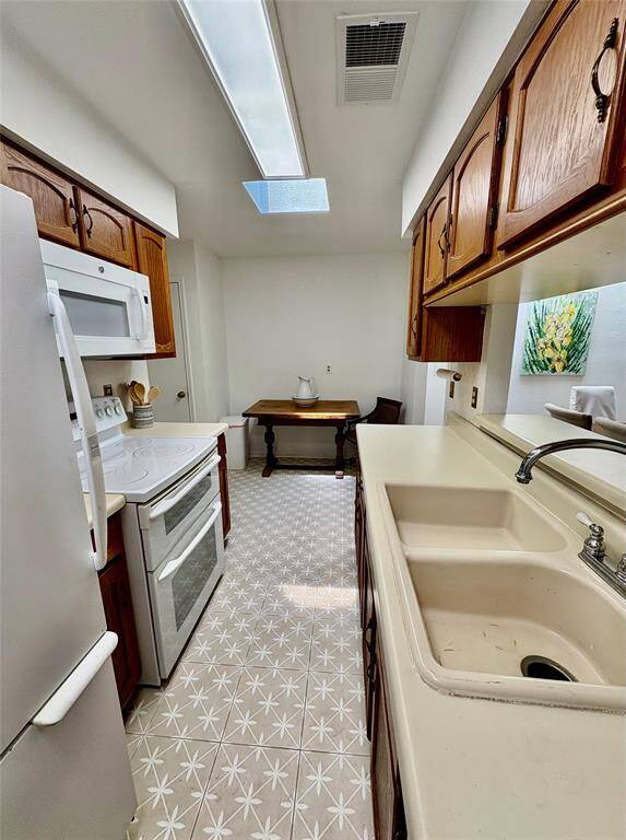 The far wall has many options of wall space one option is to add cabinets and counter space. Design it your way!