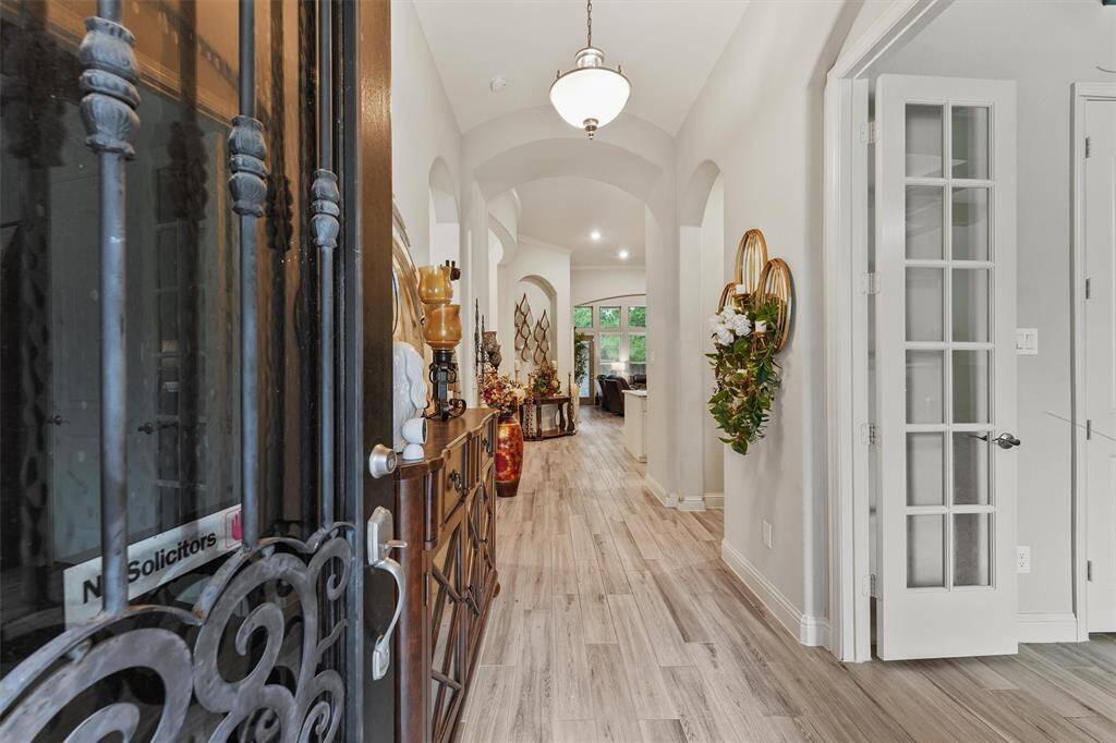 Lovely wood-look tile flows throughout the main living areas
