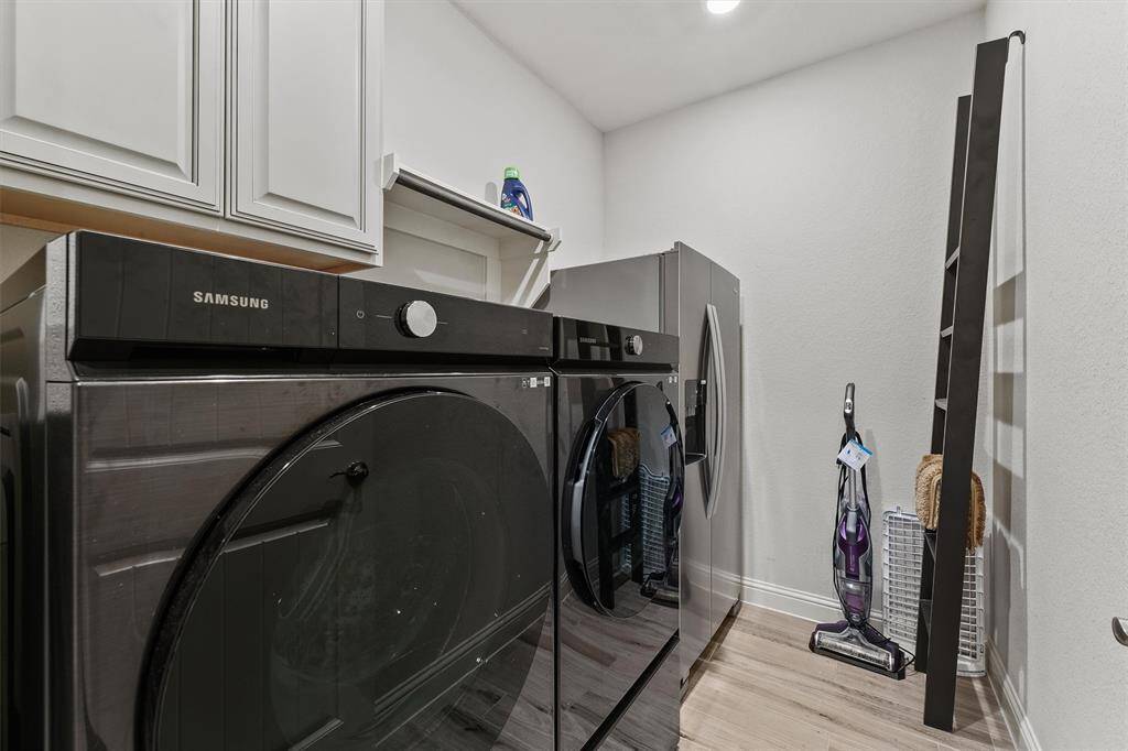 Laundry room with room for a second fridge